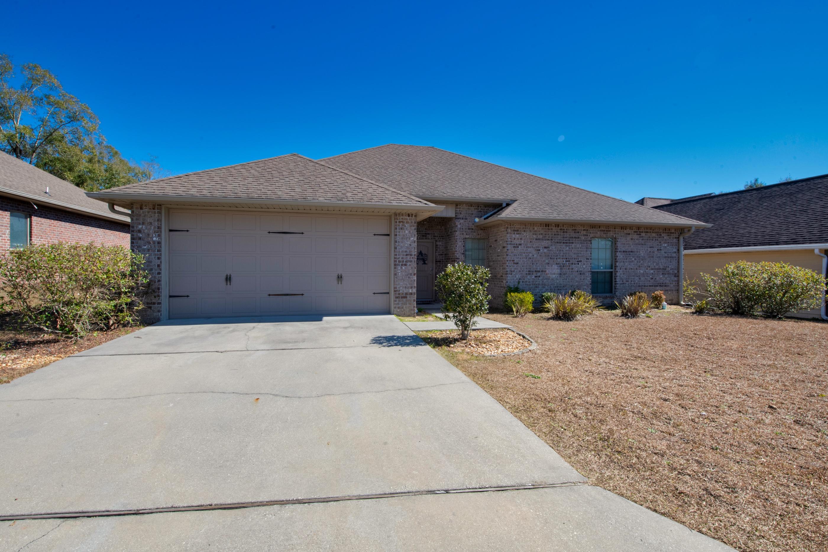4608 Hermosa Road Crestview, FL 32539 - Photo 3 of 26 a view of a house with a patio