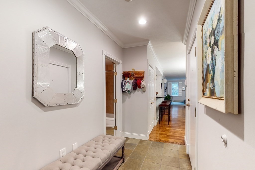 476 Shawmut Avenue, Unit 3 Boston, MA 02118 - Photo 15 of 29 a hallway with a wooden floor and a mirror
