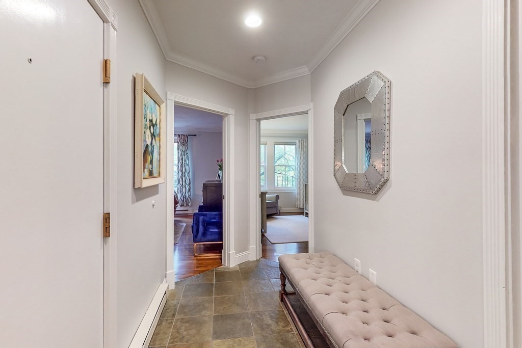 476 Shawmut Avenue, Unit 3 Boston, MA 02118 - Photo 16 of 29 a bedroom with furniture and a mirror