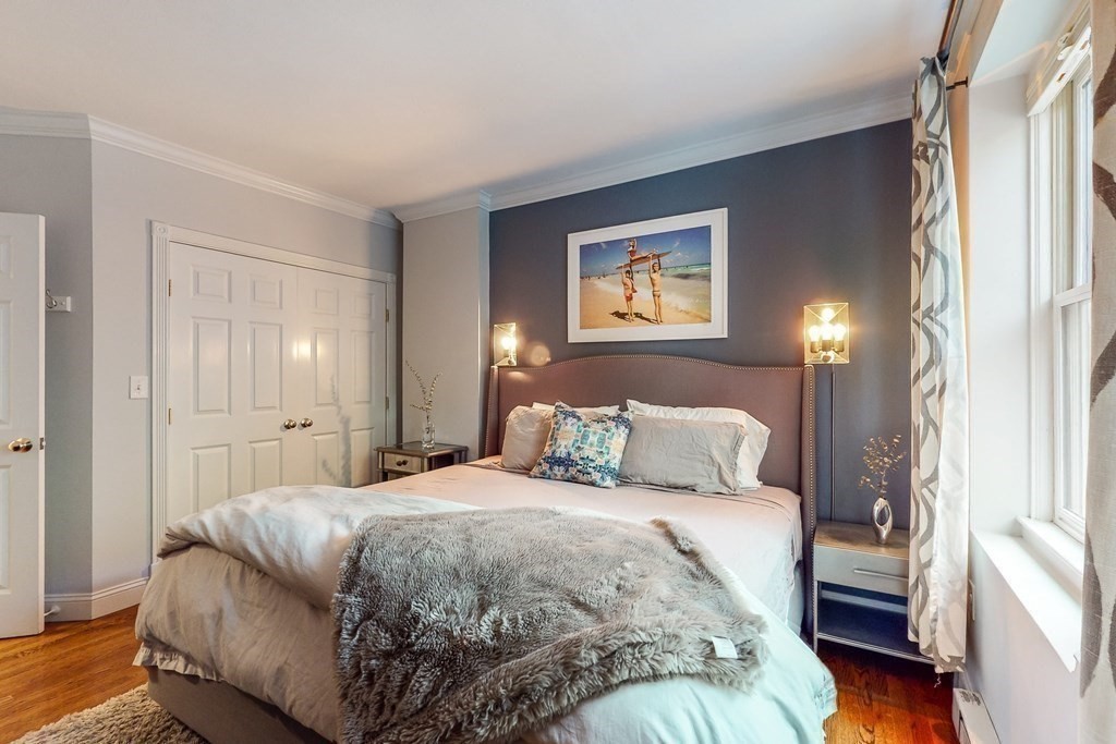 476 Shawmut Avenue, Unit 3 Boston, MA 02118 - Photo 17 of 29 a bedroom with a bed and a painting on the wall