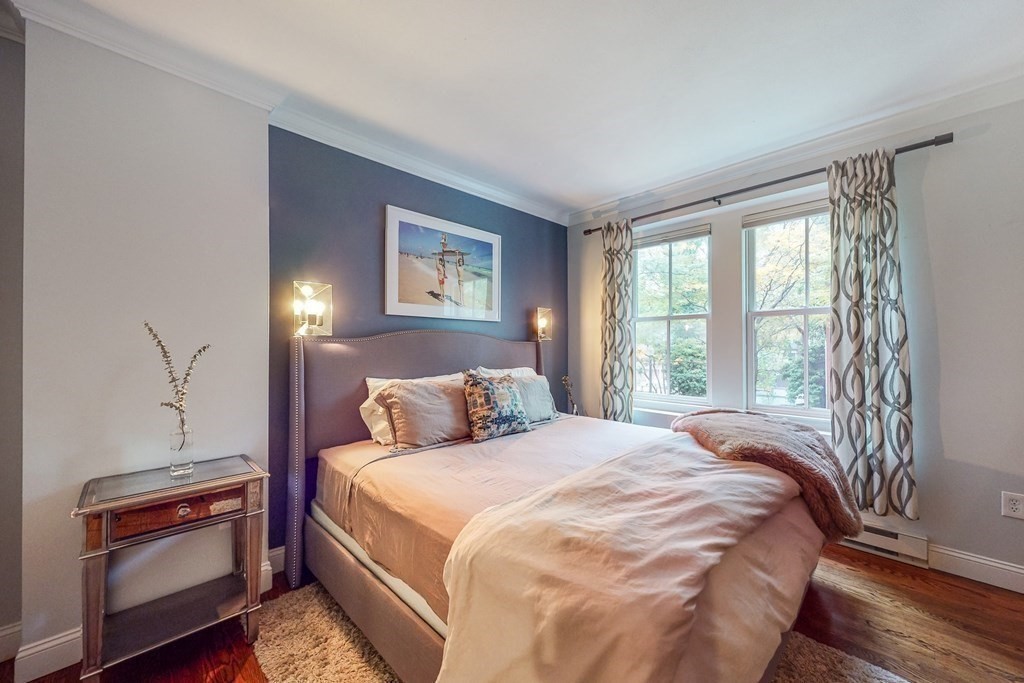476 Shawmut Avenue, Unit 3 Boston, MA 02118 - Photo 18 of 29 a bedroom with a bed and a lamp on dresser