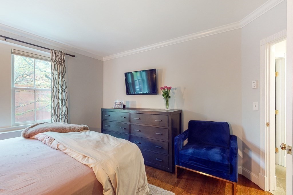 476 Shawmut Avenue, Unit 3 Boston, MA 02118 - Photo 19 of 29 a bedroom with a bed and furniture