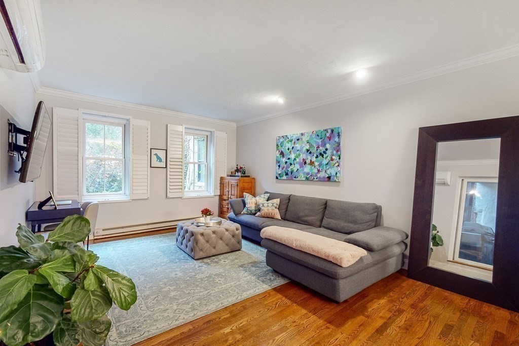 476 Shawmut Avenue, Unit 3 Boston, MA 02118 - Photo 2 of 29 a living room with furniture and a large window