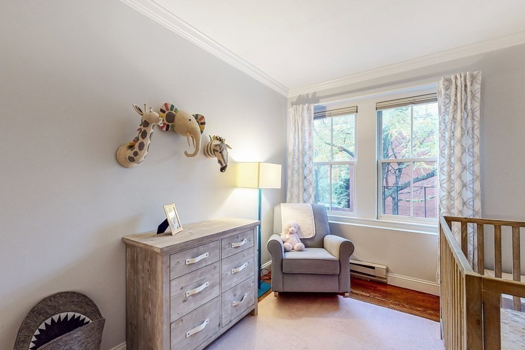 476 Shawmut Avenue, Unit 3 Boston, MA 02118 - Photo 21 of 29 a bedroom with a bed and a window