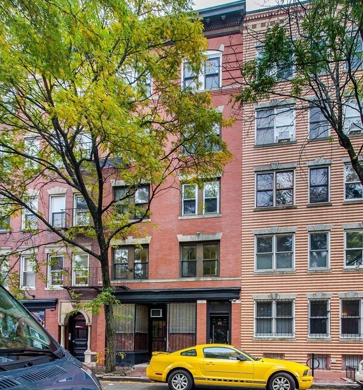 476 Shawmut Avenue, Unit 3 Boston, MA 02118 - Photo 28 of 29 a front view of a building with parking lot of windows