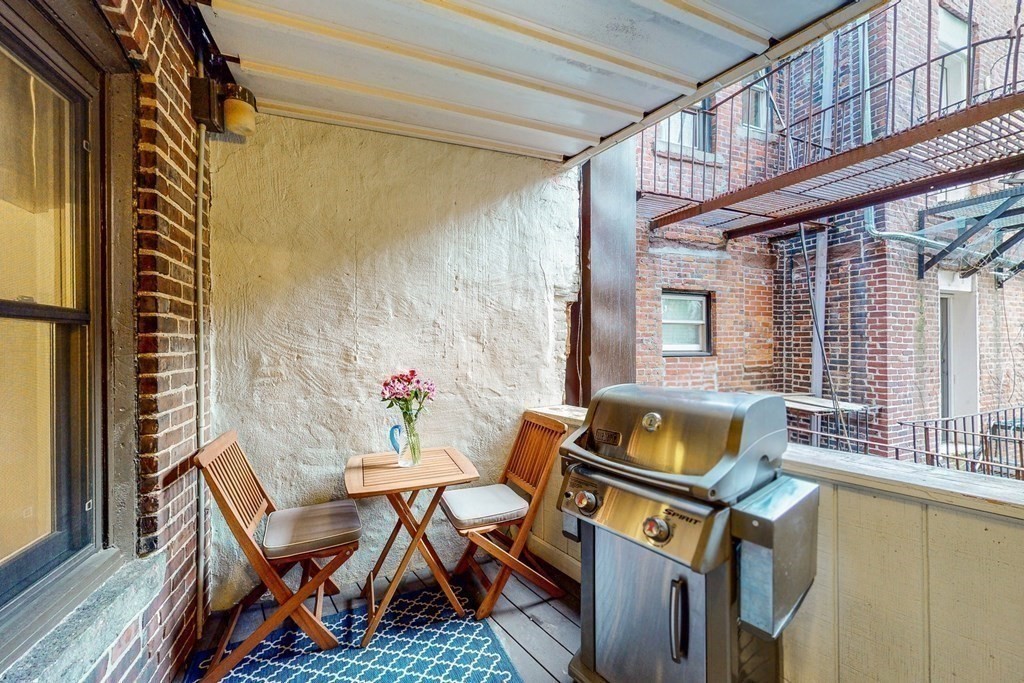 476 Shawmut Avenue, Unit 3 Boston, MA 02118 - Photo 5 of 29 a view of a patio with table and chairs and potted plants