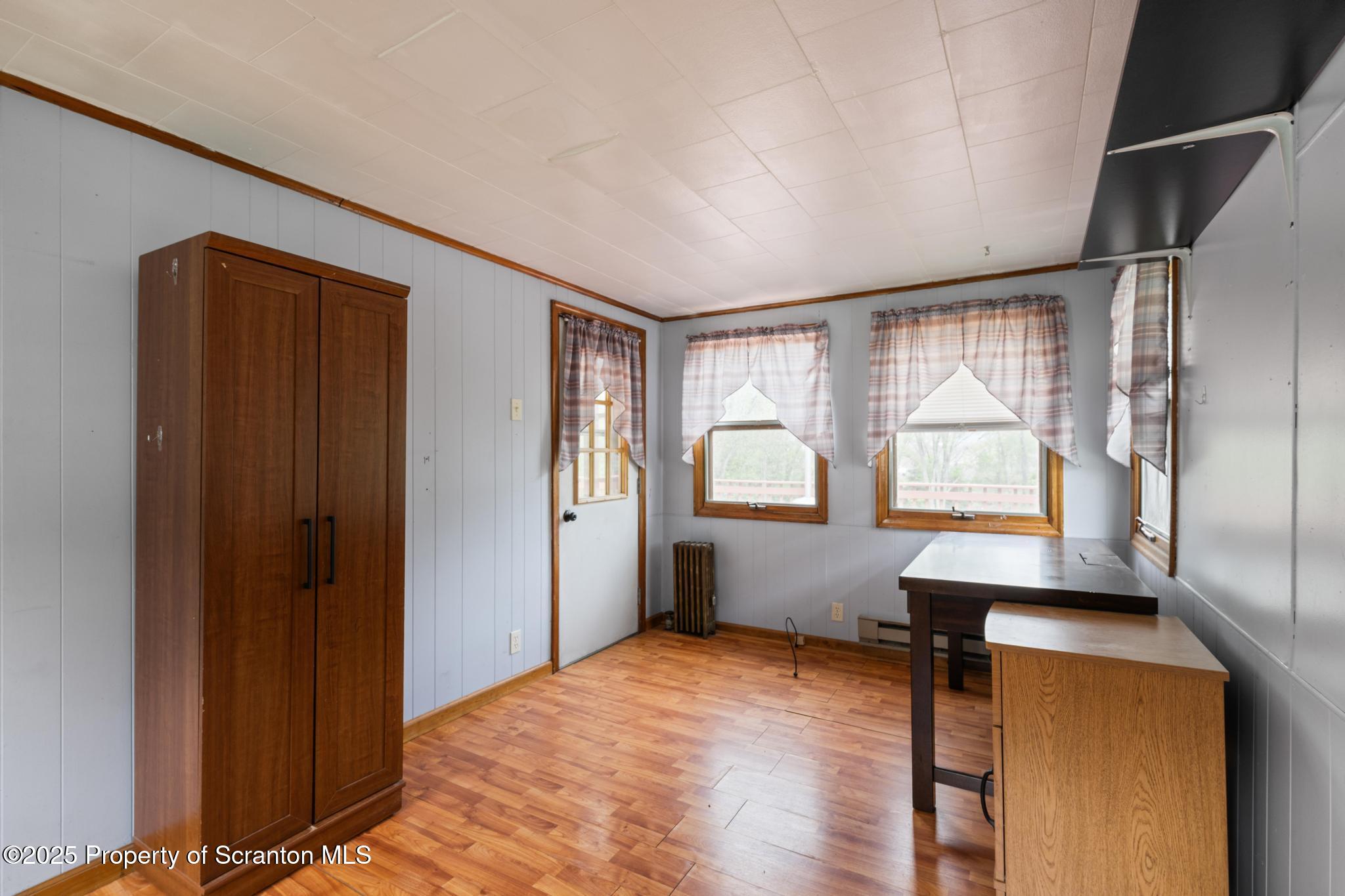 730 Chase Road Shavertown, PA 18708 - Photo 22 of 43 a view of an empty room with window and wooden floor