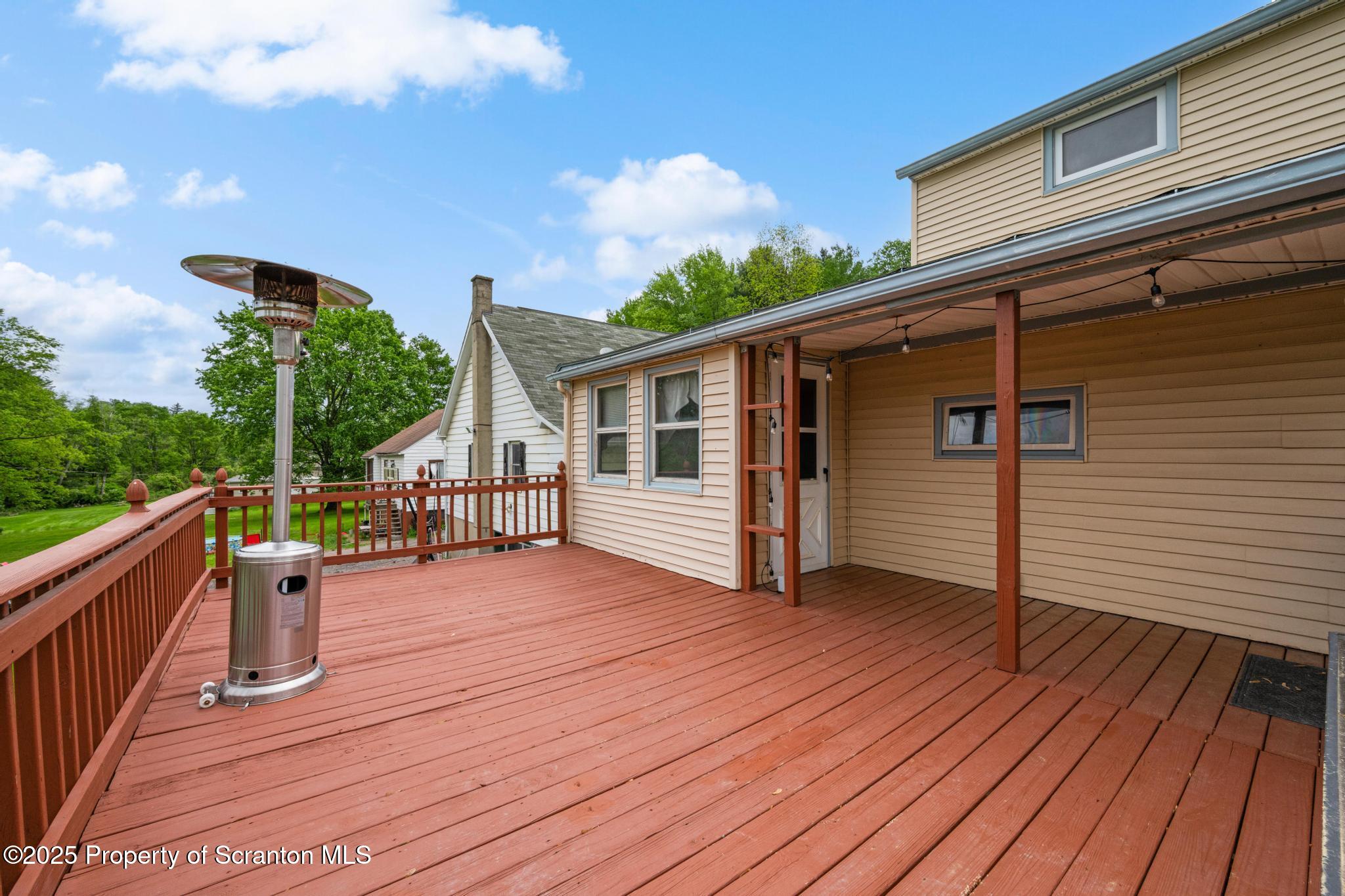 730 Chase Road Shavertown, PA 18708 - Photo 25 of 43 a view of a house with wooden deck
