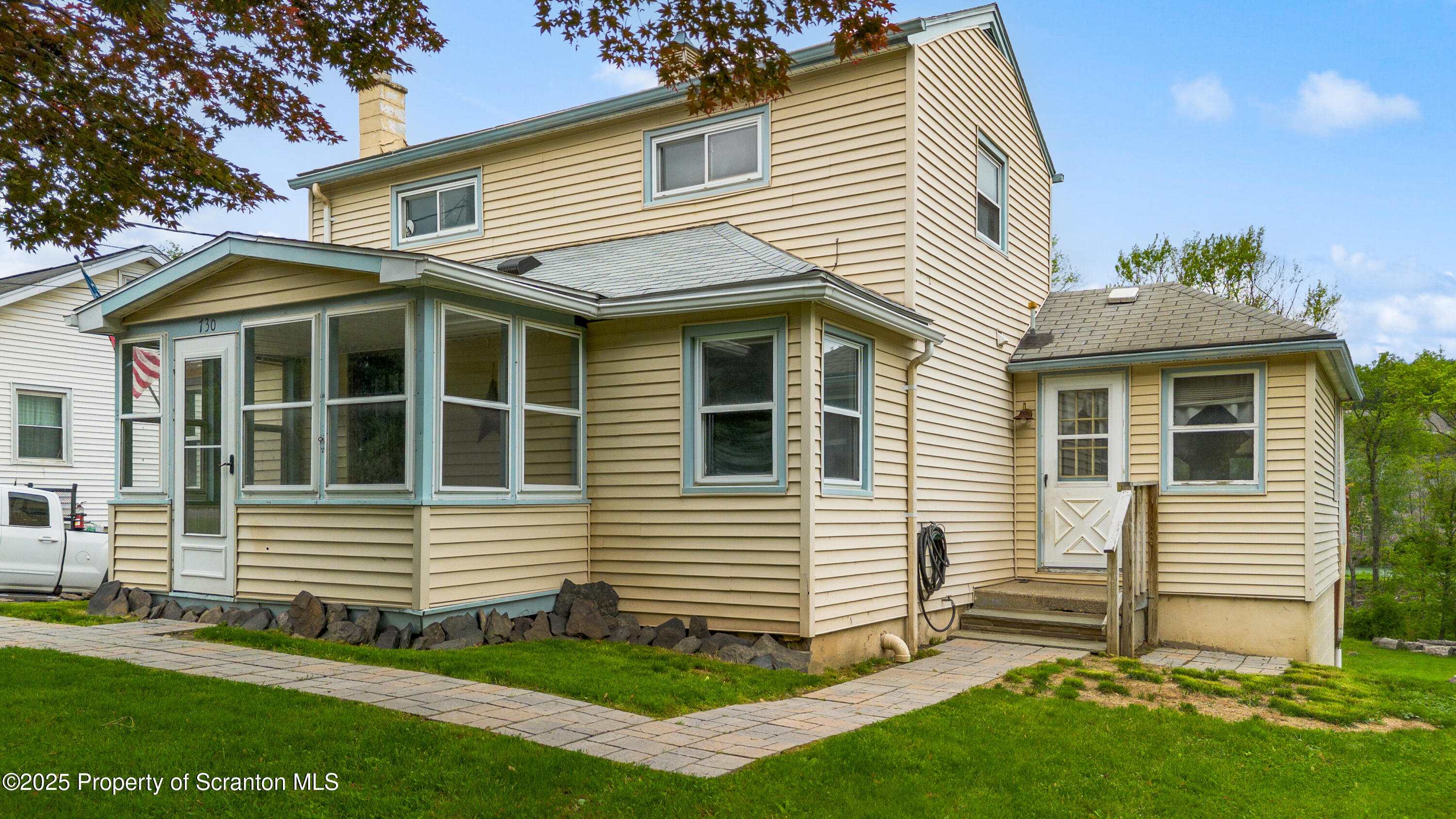 730 Chase Road Shavertown, PA 18708 - Photo 3 of 43 a view of a house with a yard and a garden