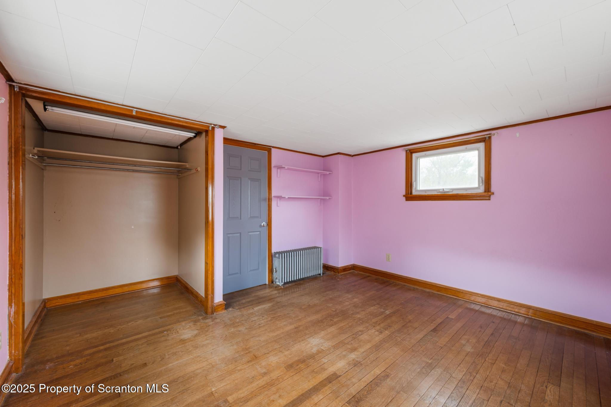 730 Chase Road Shavertown, PA 18708 - Photo 32 of 43 an empty room with wooden floor and closet