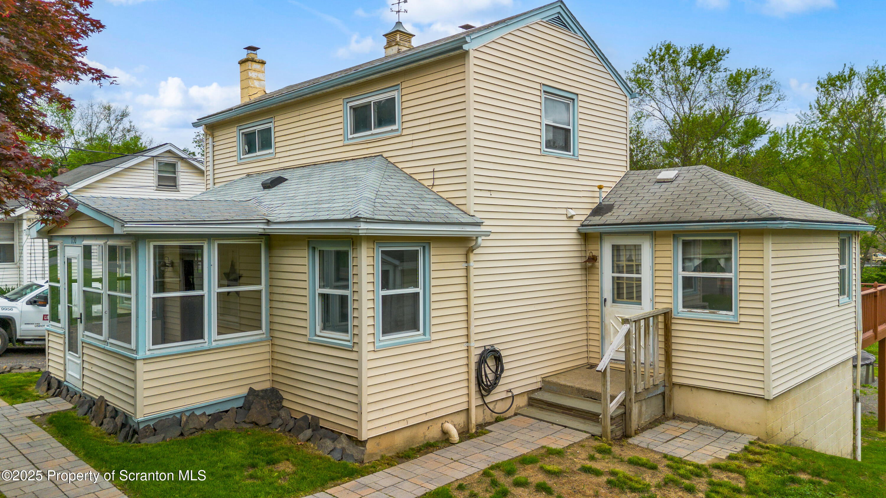 730 Chase Road Shavertown, PA 18708 - Photo 4 of 43 a view of a white house with a small yard and plants