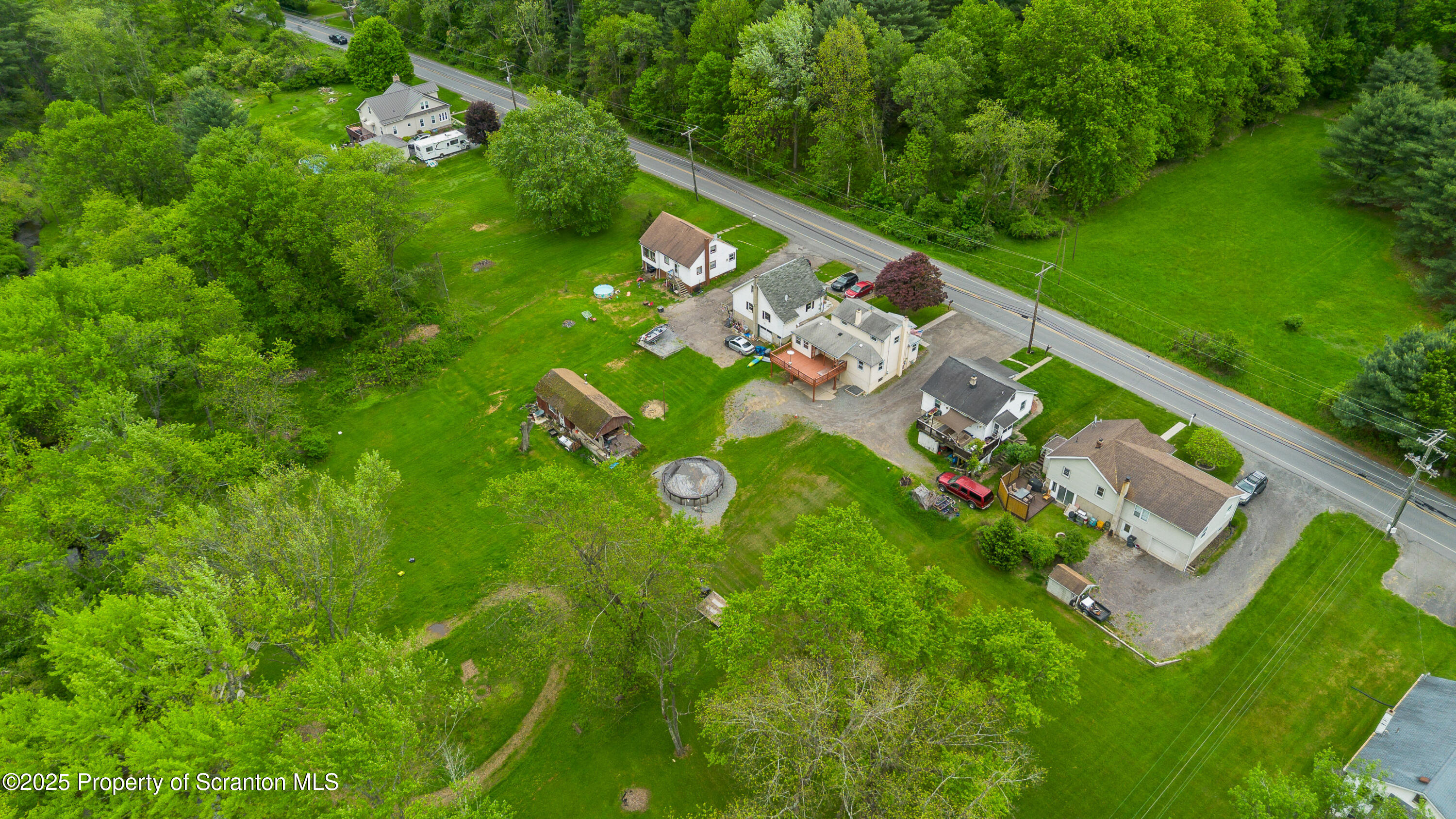 730 Chase Road Shavertown, PA 18708 - Photo 7 of 43 a view of a yard with a tree