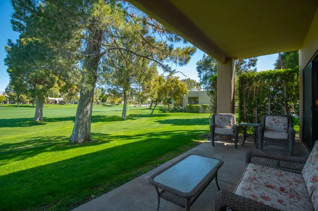 a view of a house with a yard and plants