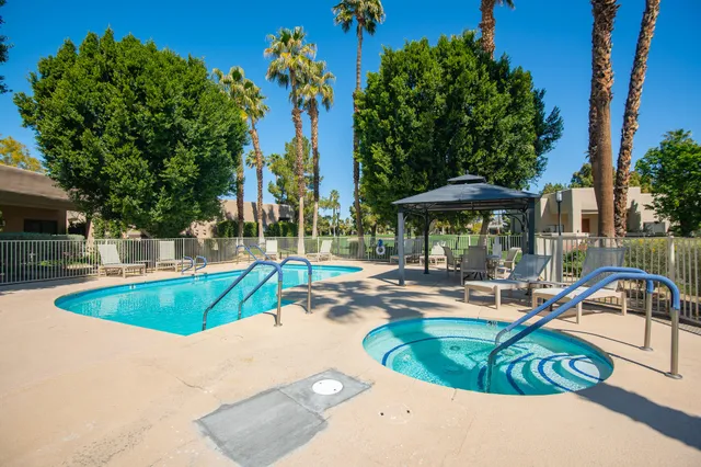a view of swimming pool with chairs