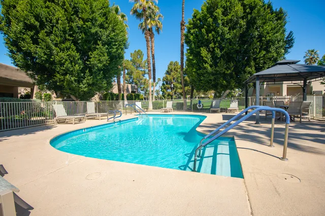 a kitchen with stainless steel appliances granite countertop a stove and a refrigerator