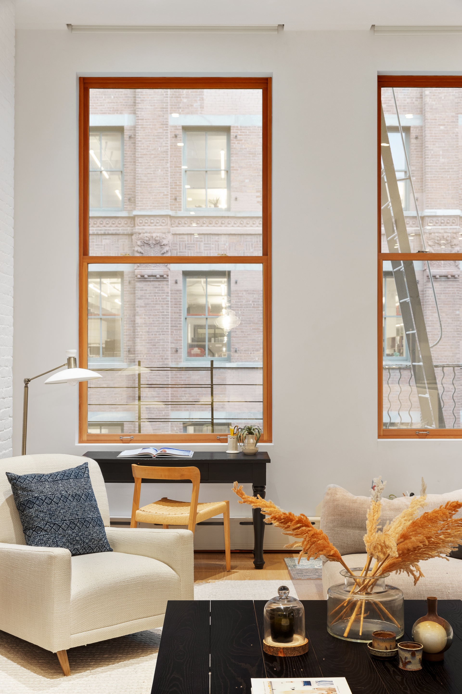 121 Mercer Street, Unit 4 Manhattan, NY 10012 - Photo 2 of 14 a living room with a couch and a window