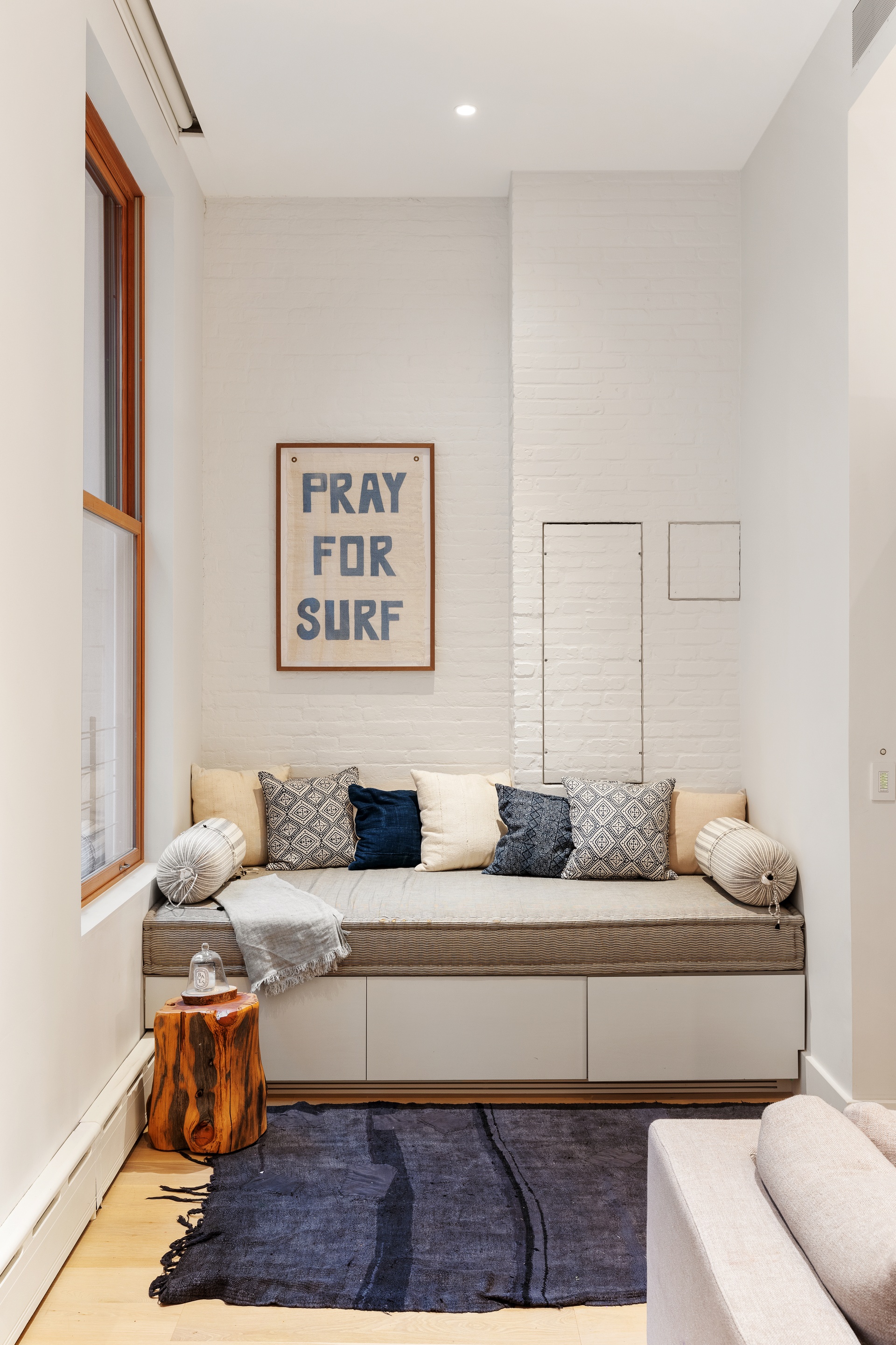 121 Mercer Street, Unit 4 Manhattan, NY 10012 - Photo 6 of 14 a living room with furniture and a couch