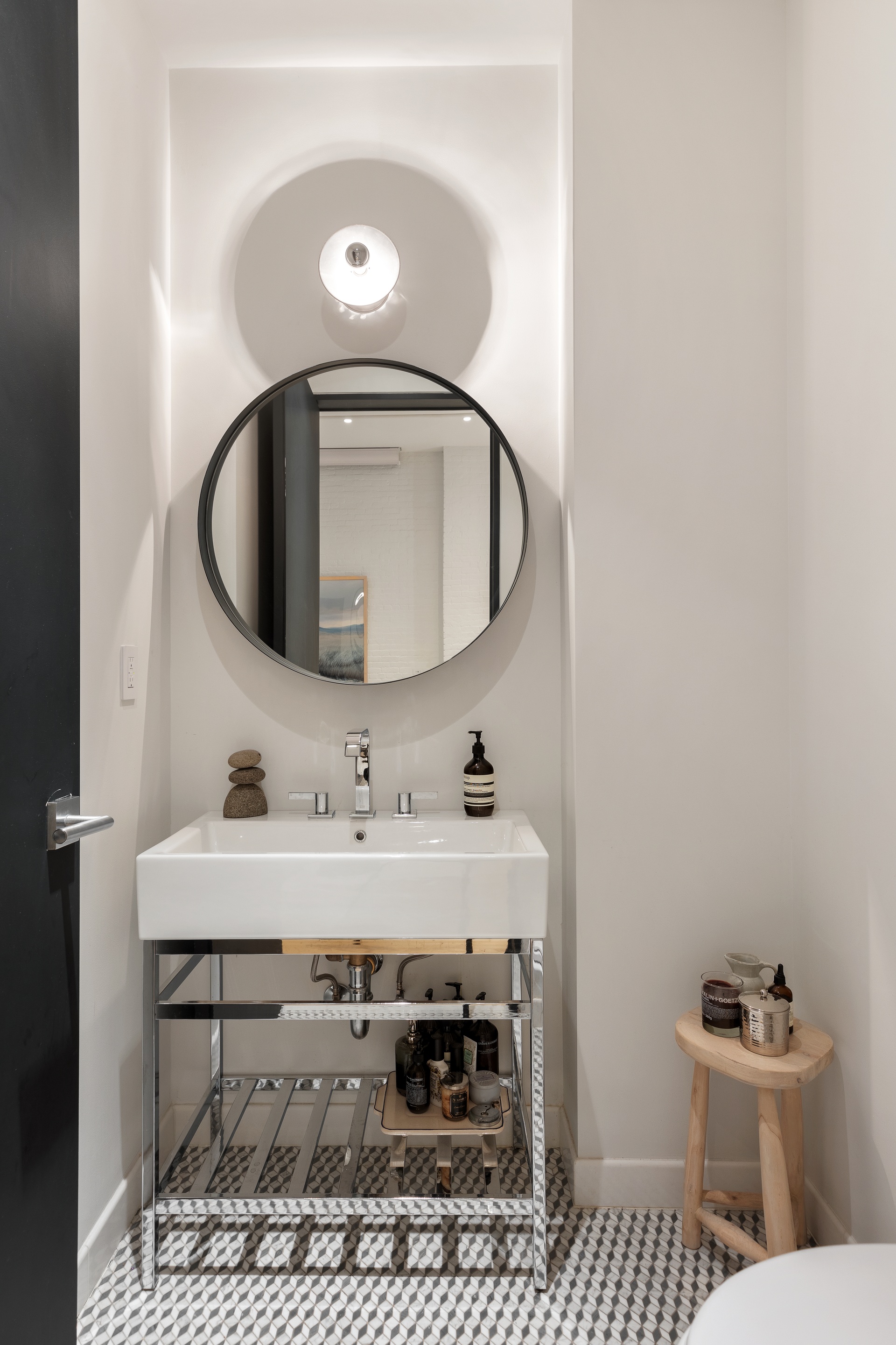121 Mercer Street, Unit 4 Manhattan, NY 10012 - Photo 7 of 14 a bathroom with a sink and a mirror