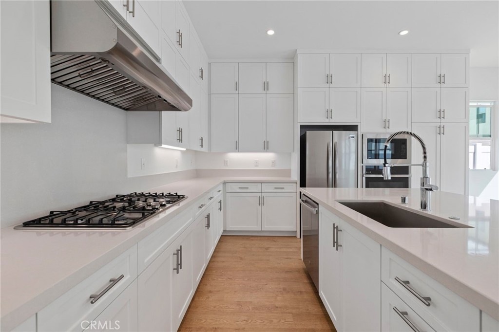 43 Miren Place Arcadia, CA 91007 - Photo 14 of 37 a kitchen with white cabinets and appliances