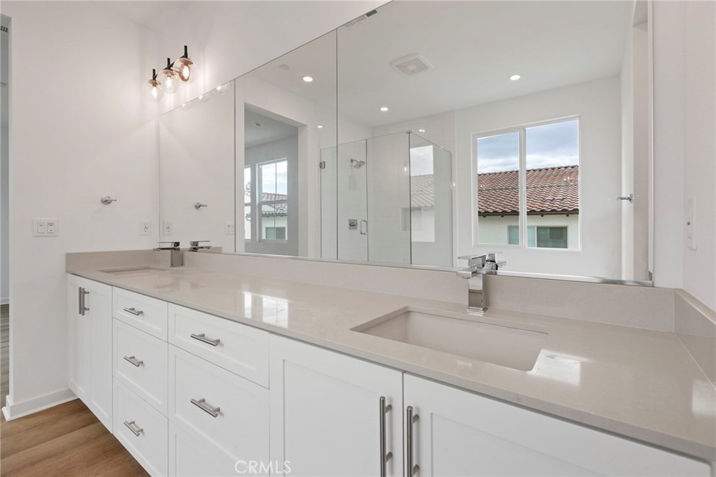 43 Miren Place Arcadia, CA 91007 - Photo 23 of 37 a bathroom with double vanity sinks a vanity two mirror and a next to a window