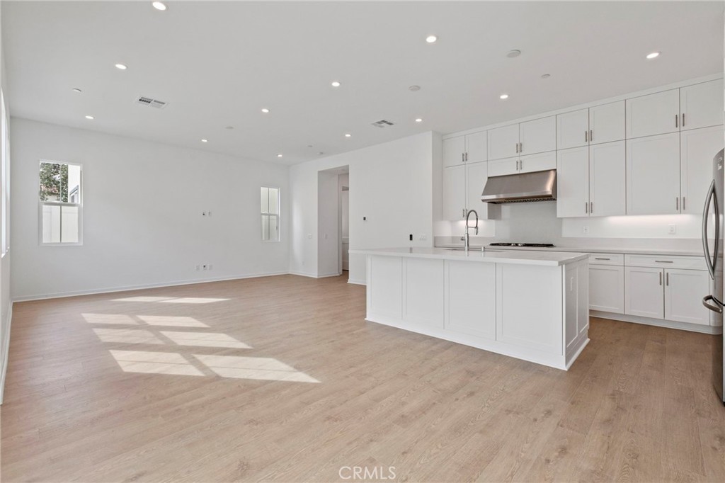 43 Miren Place Arcadia, CA 91007 - Photo 10 of 37 a large white kitchen with cabinets and a sink