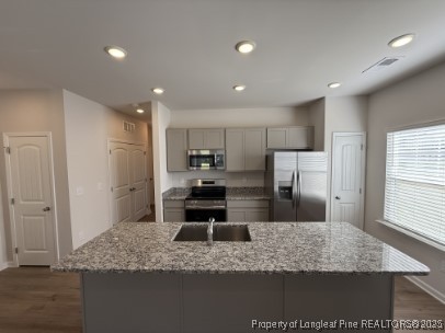 274 Deodora Lane Cameron, NC 28326 - Photo 6 of 14 a kitchen with stainless steel appliances kitchen island granite countertop a sink refrigerator and cabinets