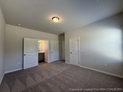 a view of an empty room and a window