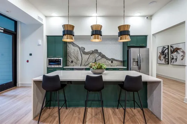 a dining room with furniture and wooden floor