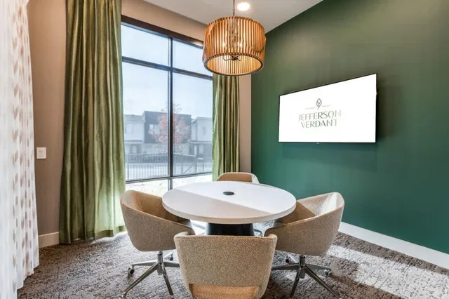 a dining room with furniture and window