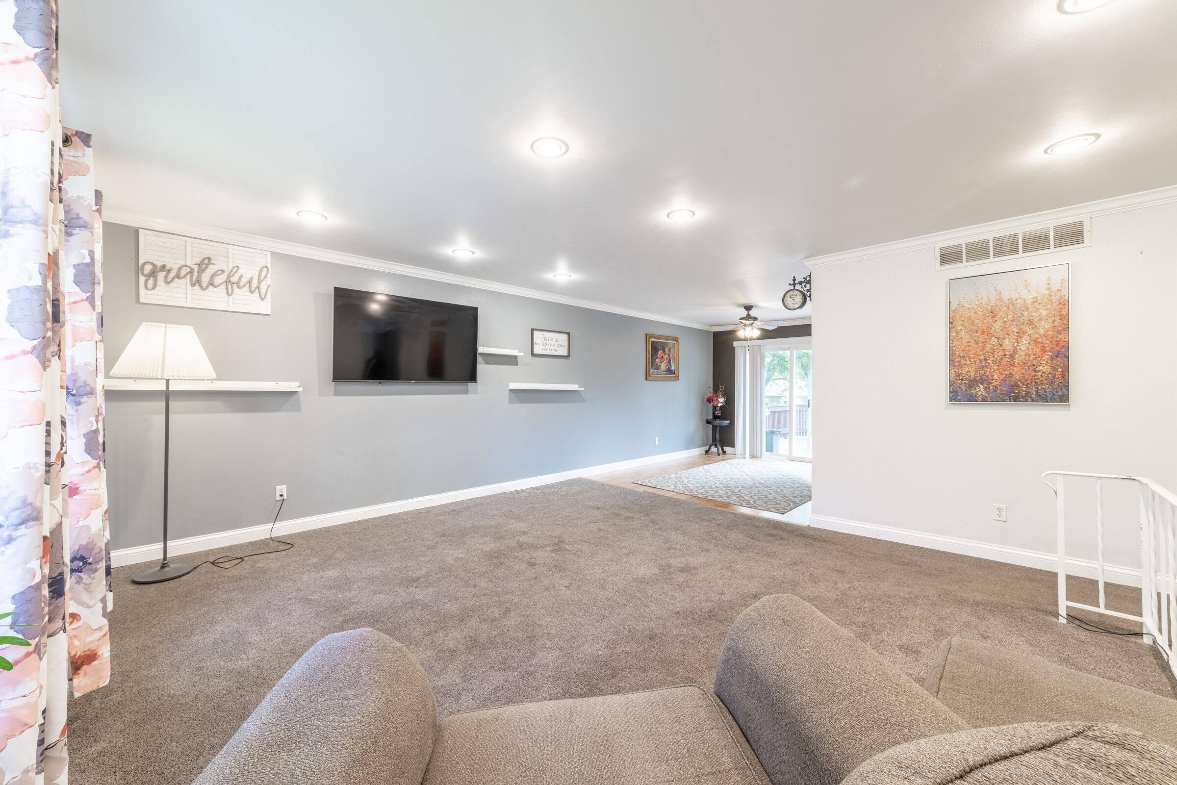 6331 Broughton Avenue Portage, IN 46368 - Photo 13 of 51 a living room with furniture and a flat screen tv