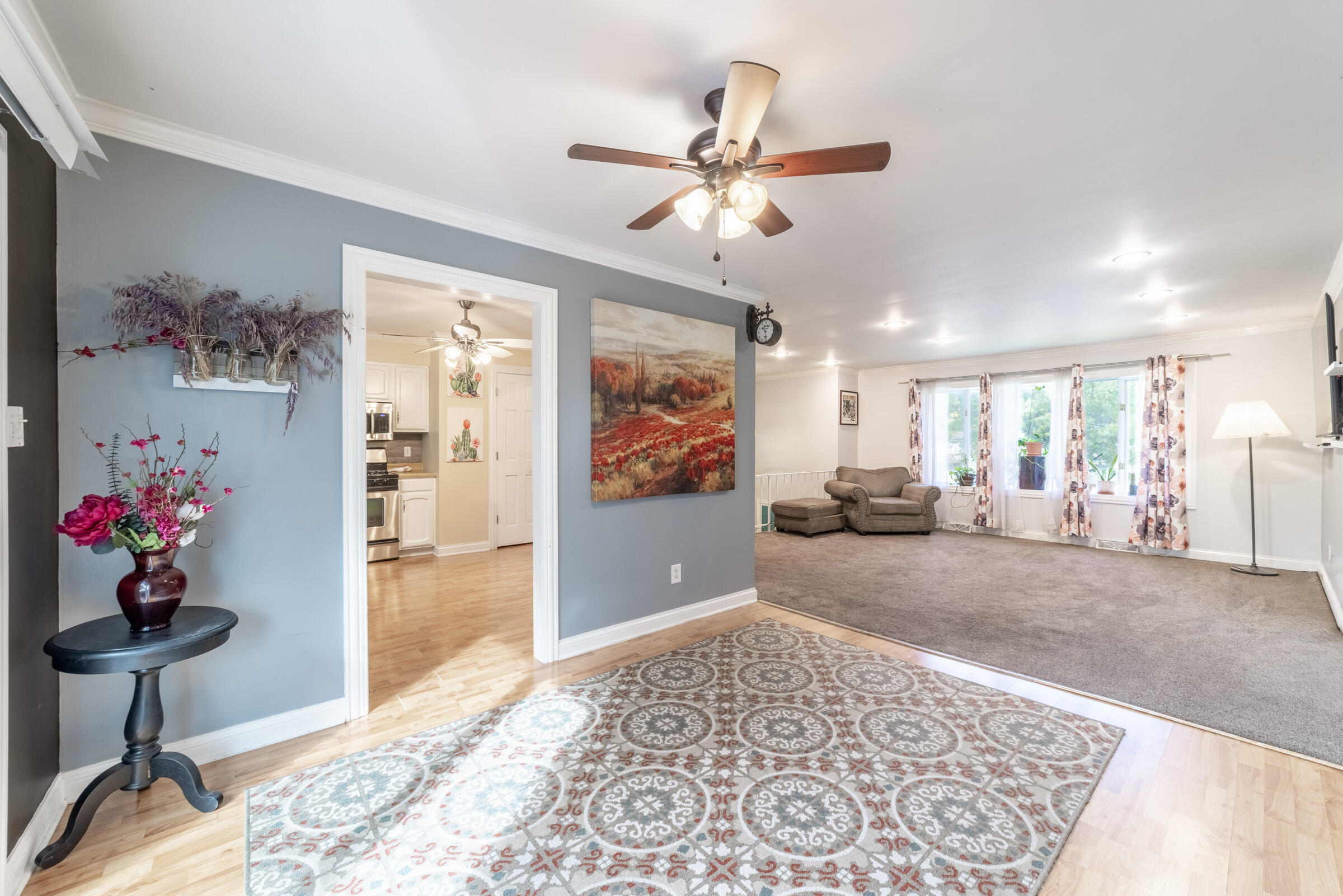 6331 Broughton Avenue Portage, IN 46368 - Photo 14 of 51 a living room with furniture and flowers