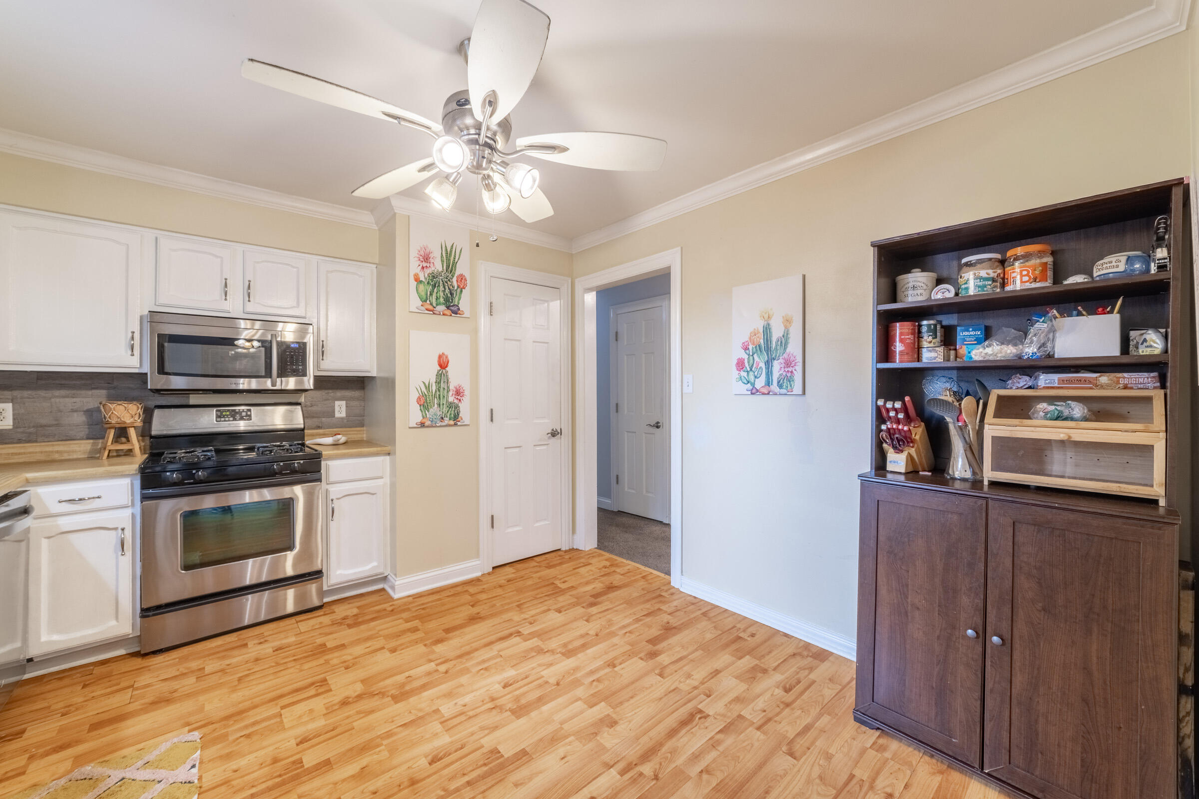 6331 Broughton Avenue Portage, IN 46368 - Photo 16 of 51 a kitchen with stainless steel appliances a stove cabinets and a refrigerator