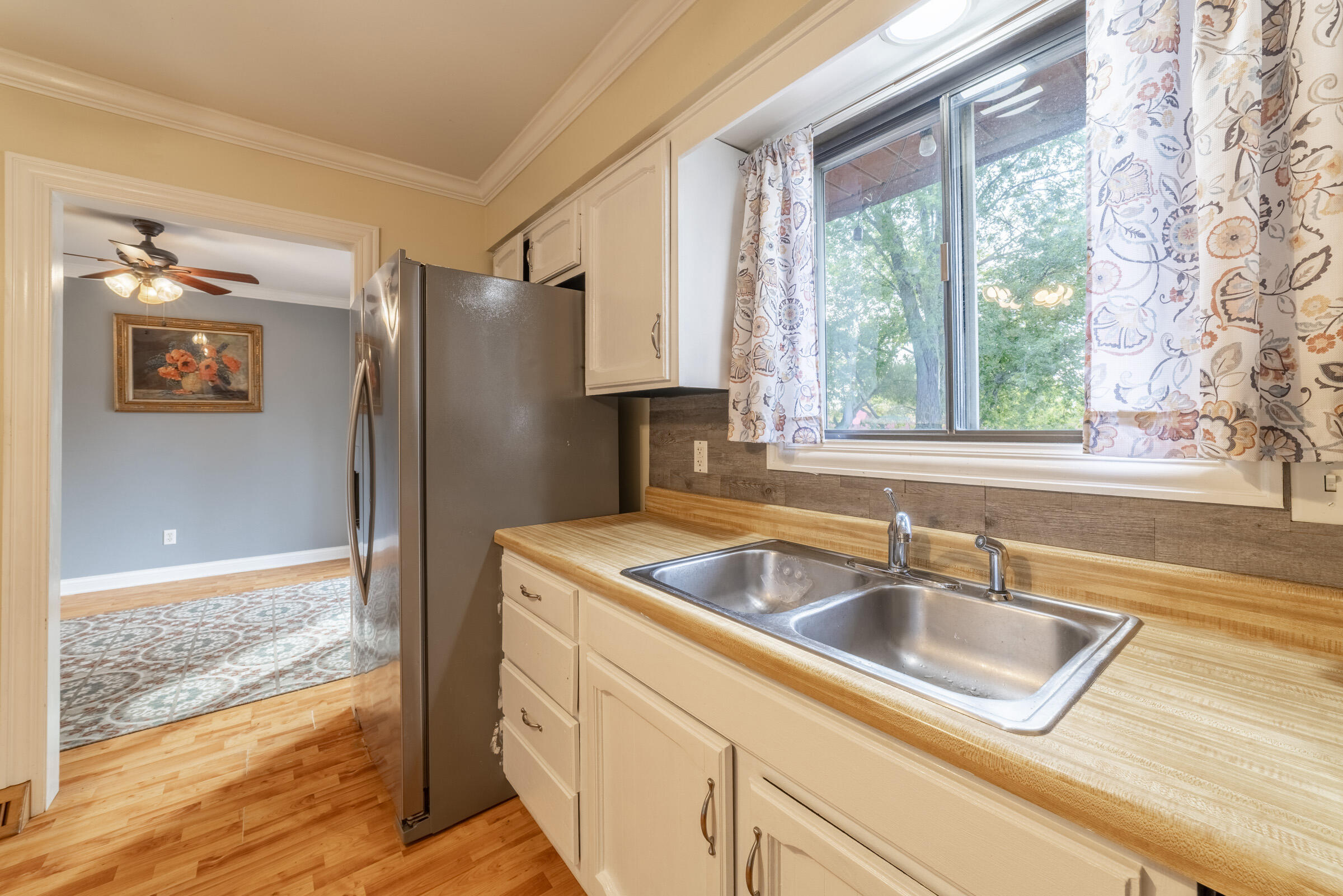 6331 Broughton Avenue Portage, IN 46368 - Photo 18 of 51 a kitchen that has a sink and a refrigerator