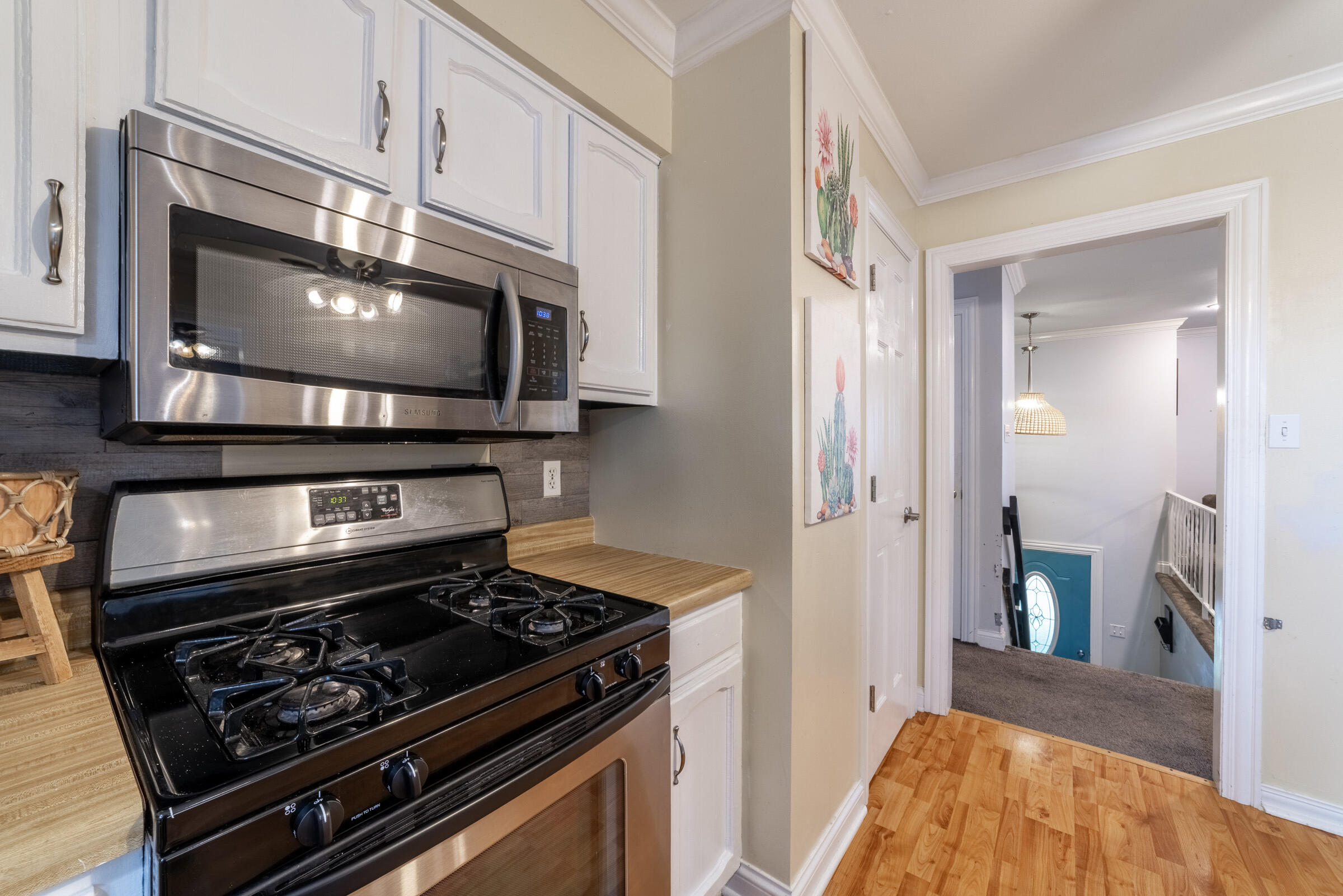 6331 Broughton Avenue Portage, IN 46368 - Photo 20 of 51 a kitchen with a stove and a microwave