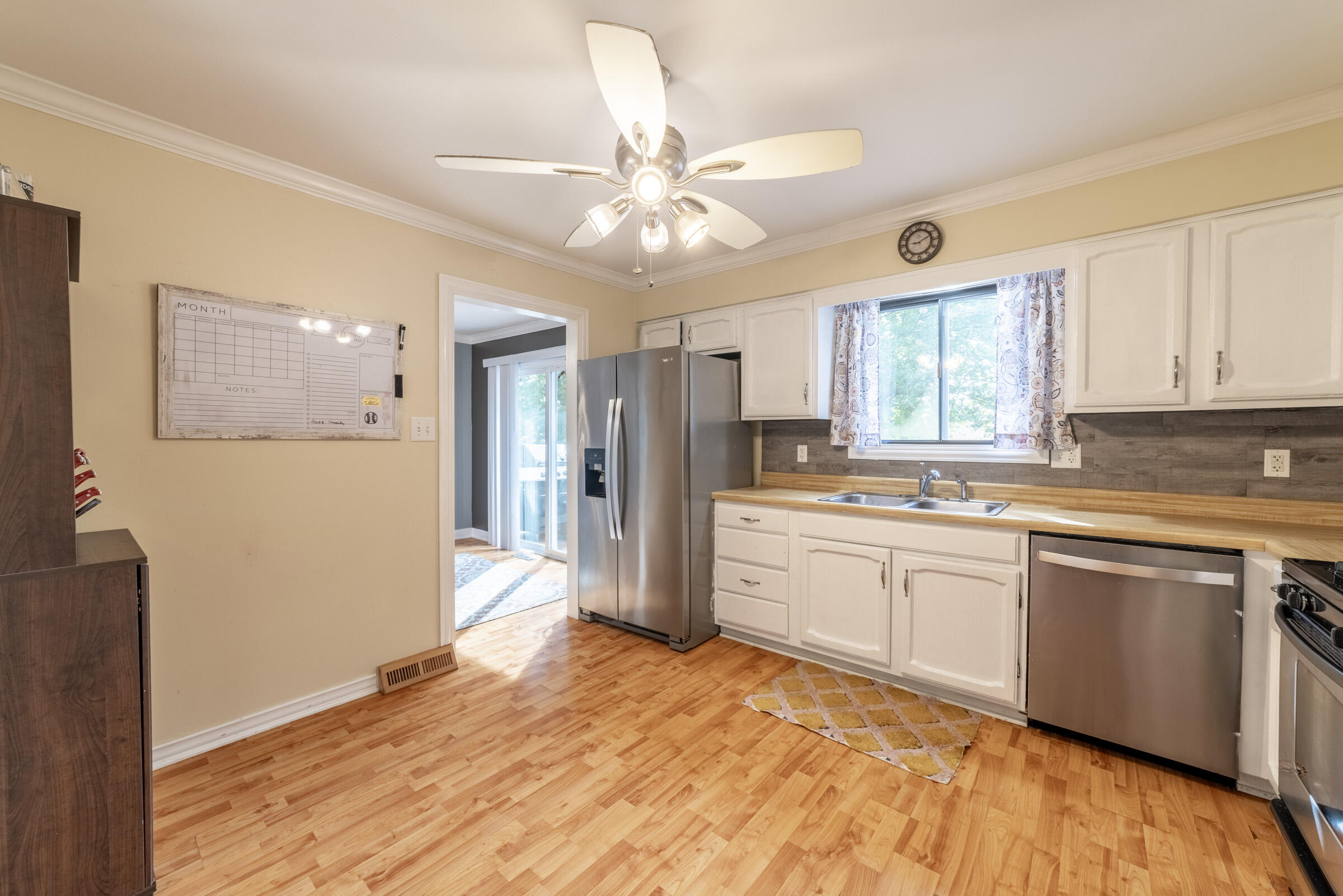 6331 Broughton Avenue Portage, IN 46368 - Photo 22 of 51 a kitchen with a refrigerator and a sink