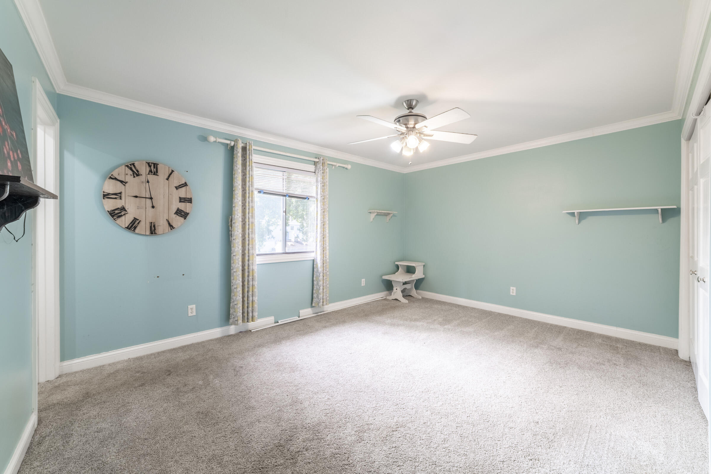 6331 Broughton Avenue Portage, IN 46368 - Photo 24 of 51 an empty room with windows and fan