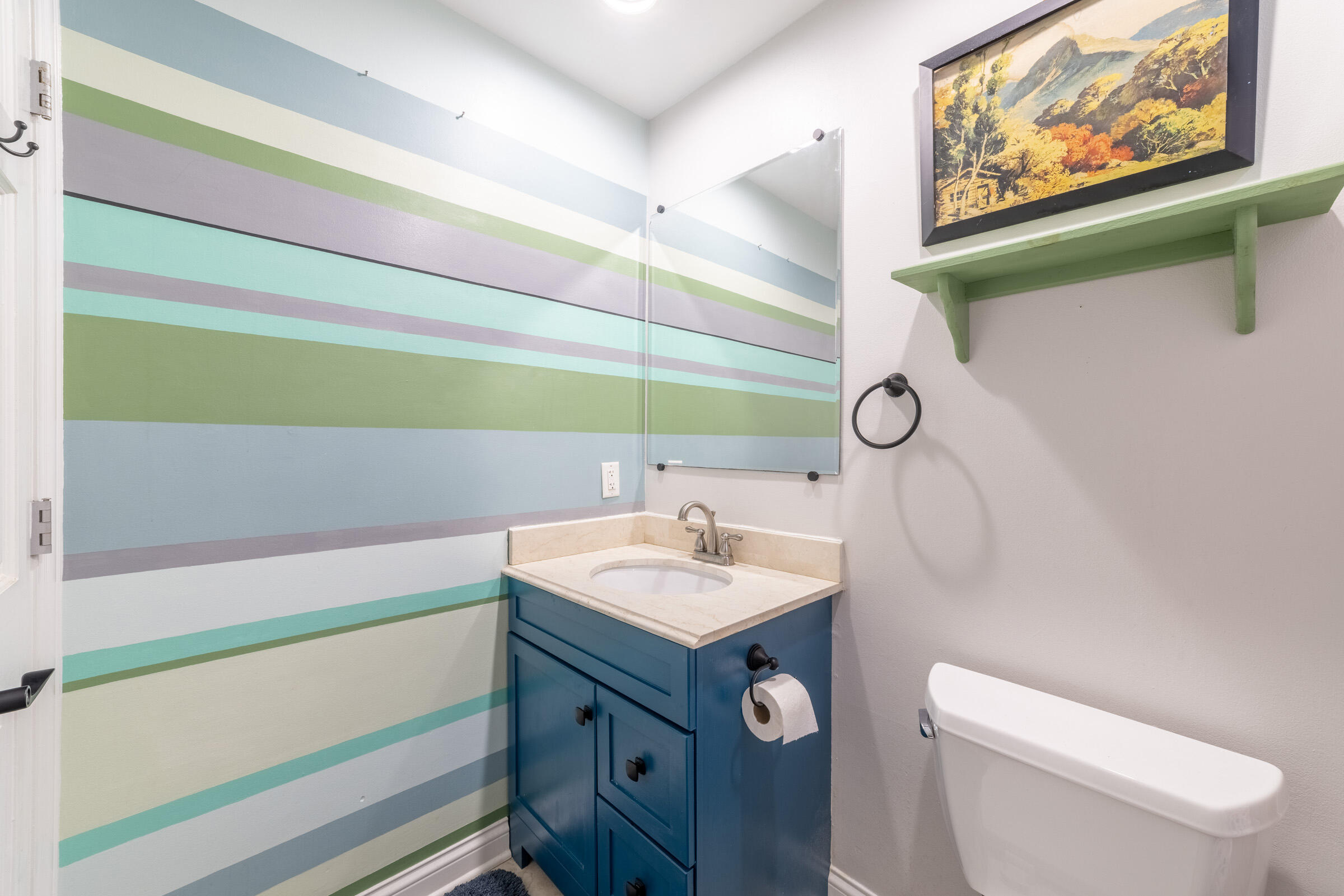 6331 Broughton Avenue Portage, IN 46368 - Photo 33 of 51 a bathroom with a sink a toilet and a mirror