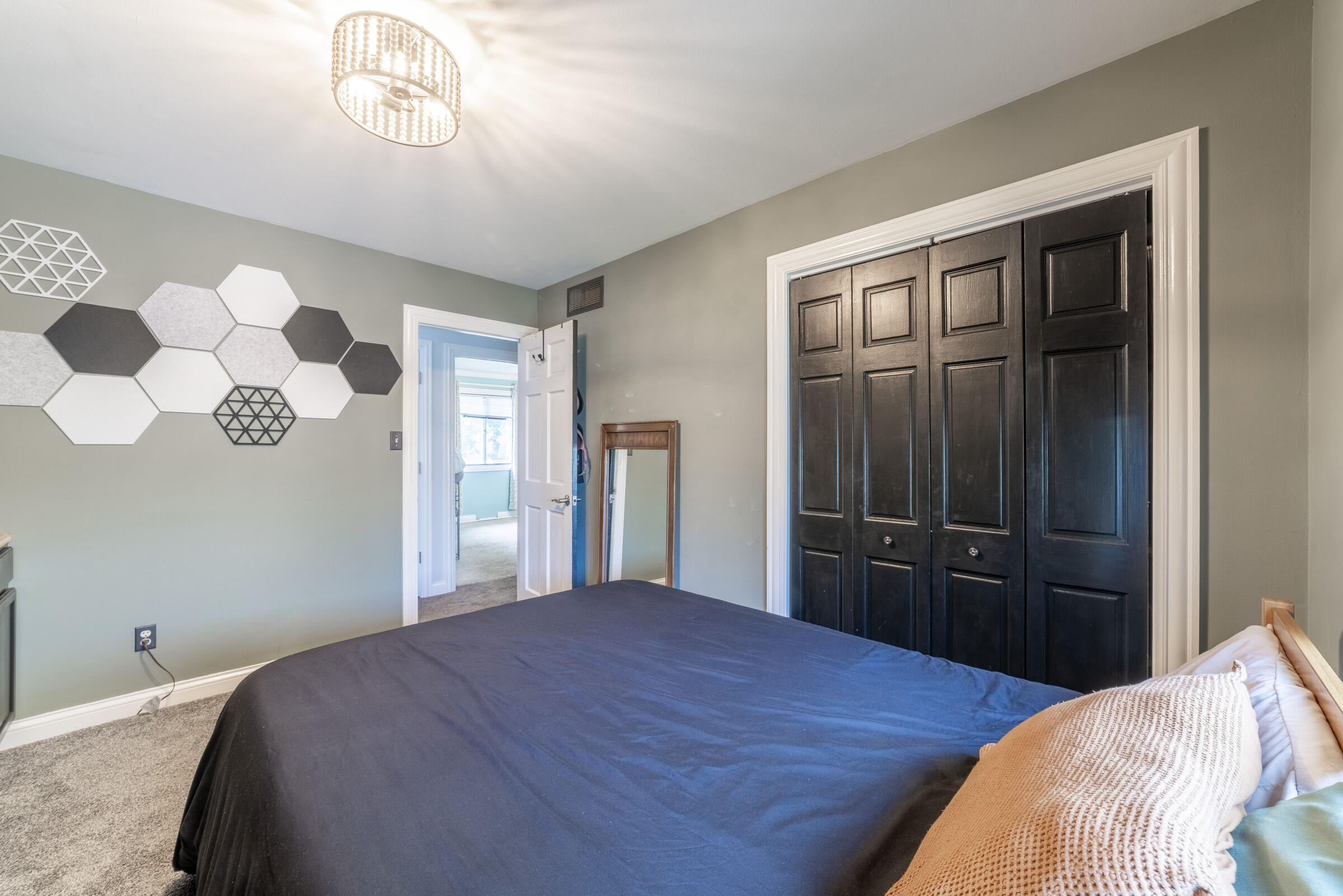 6331 Broughton Avenue Portage, IN 46368 - Photo 39 of 51 a bedroom with a bed and a dresser