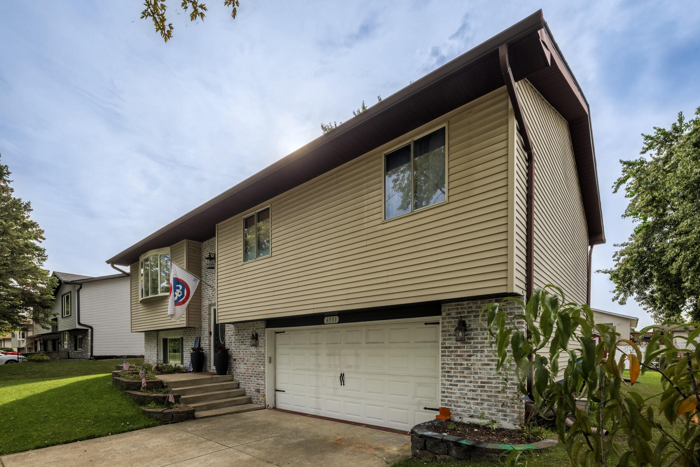 6331 Broughton Avenue Portage, IN 46368 - Photo 4 of 51 a front view of a house with a yard