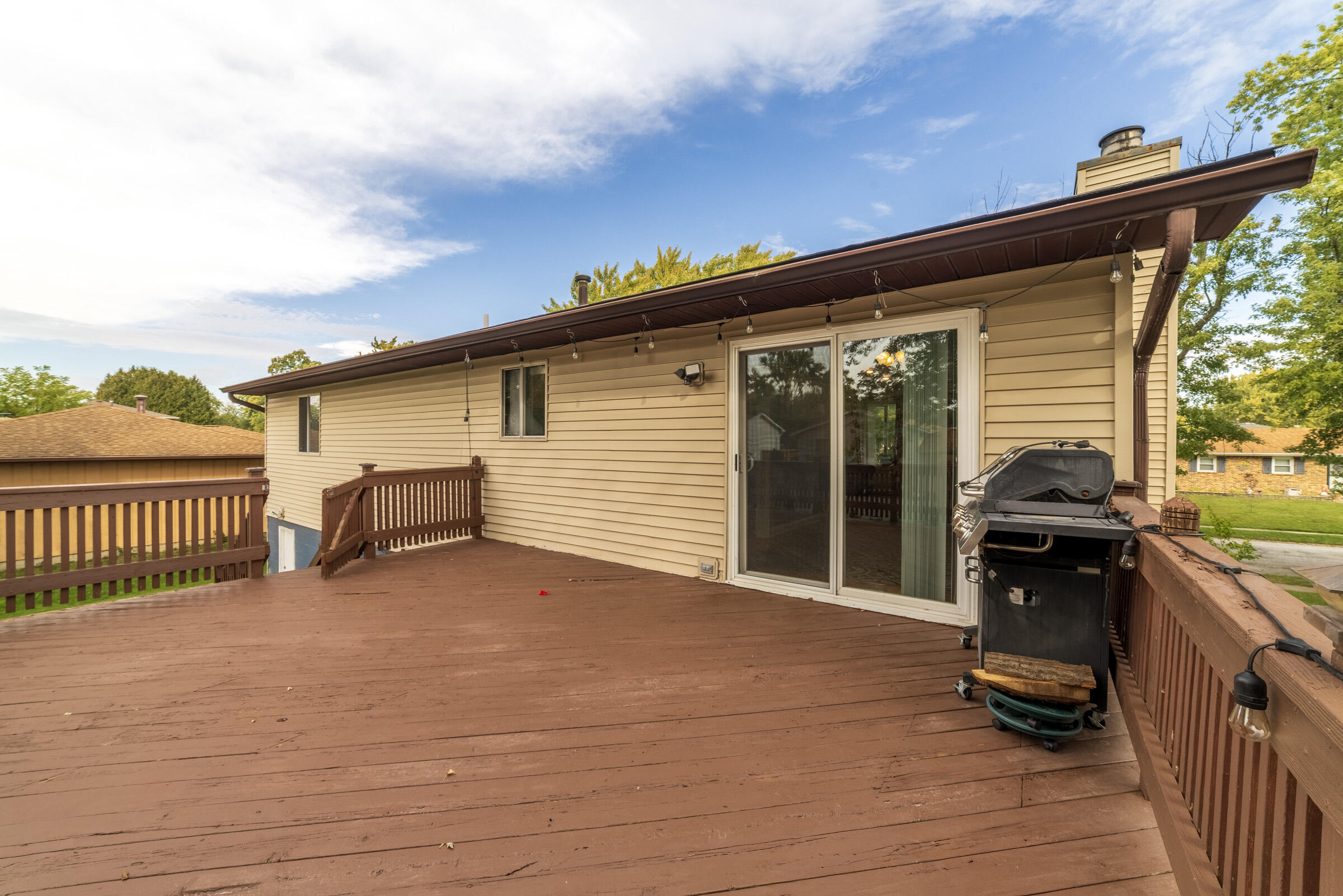 6331 Broughton Avenue Portage, IN 46368 - Photo 41 of 51 a view of a balcony with chairs and wooden floor