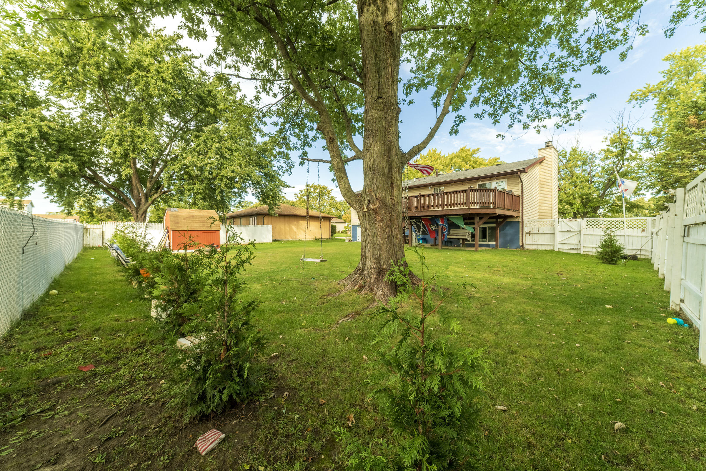 6331 Broughton Avenue Portage, IN 46368 - Photo 45 of 51 a view of a yard with plants and large trees