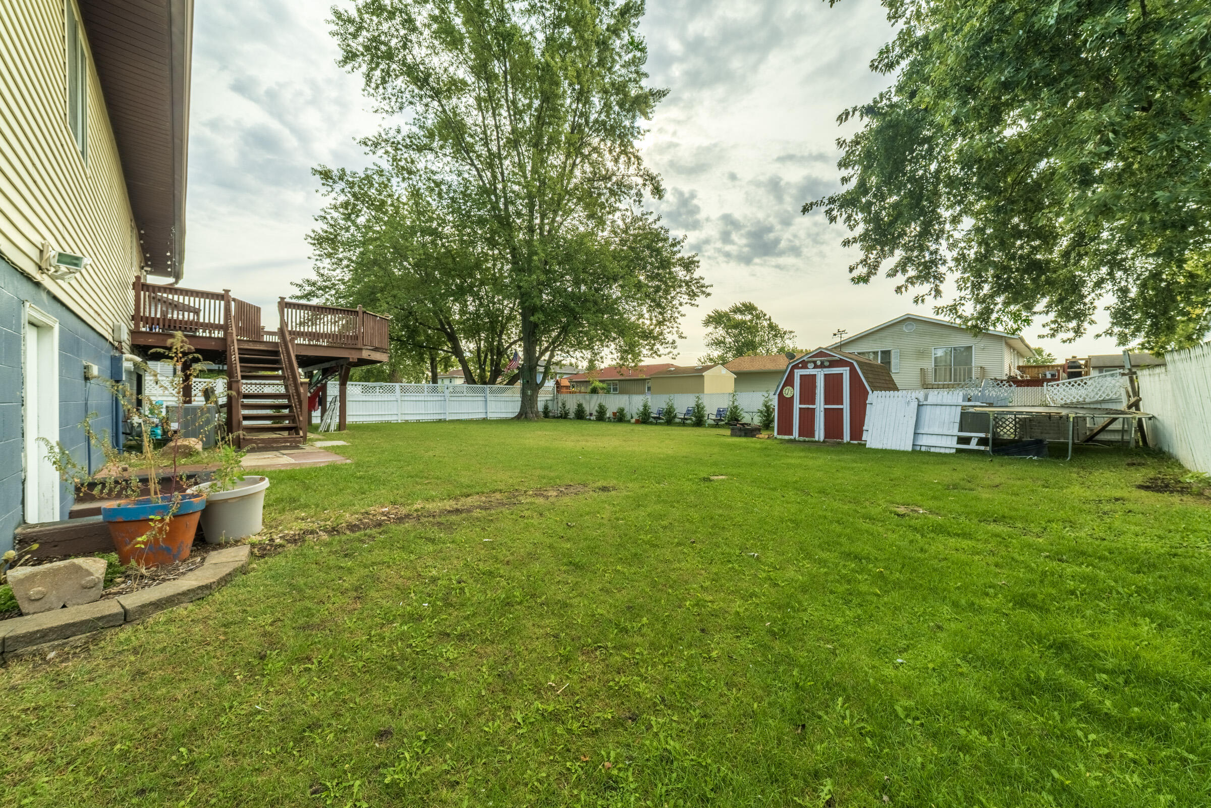 6331 Broughton Avenue Portage, IN 46368 - Photo 46 of 51 a view of a house with a yard porch and sitting area