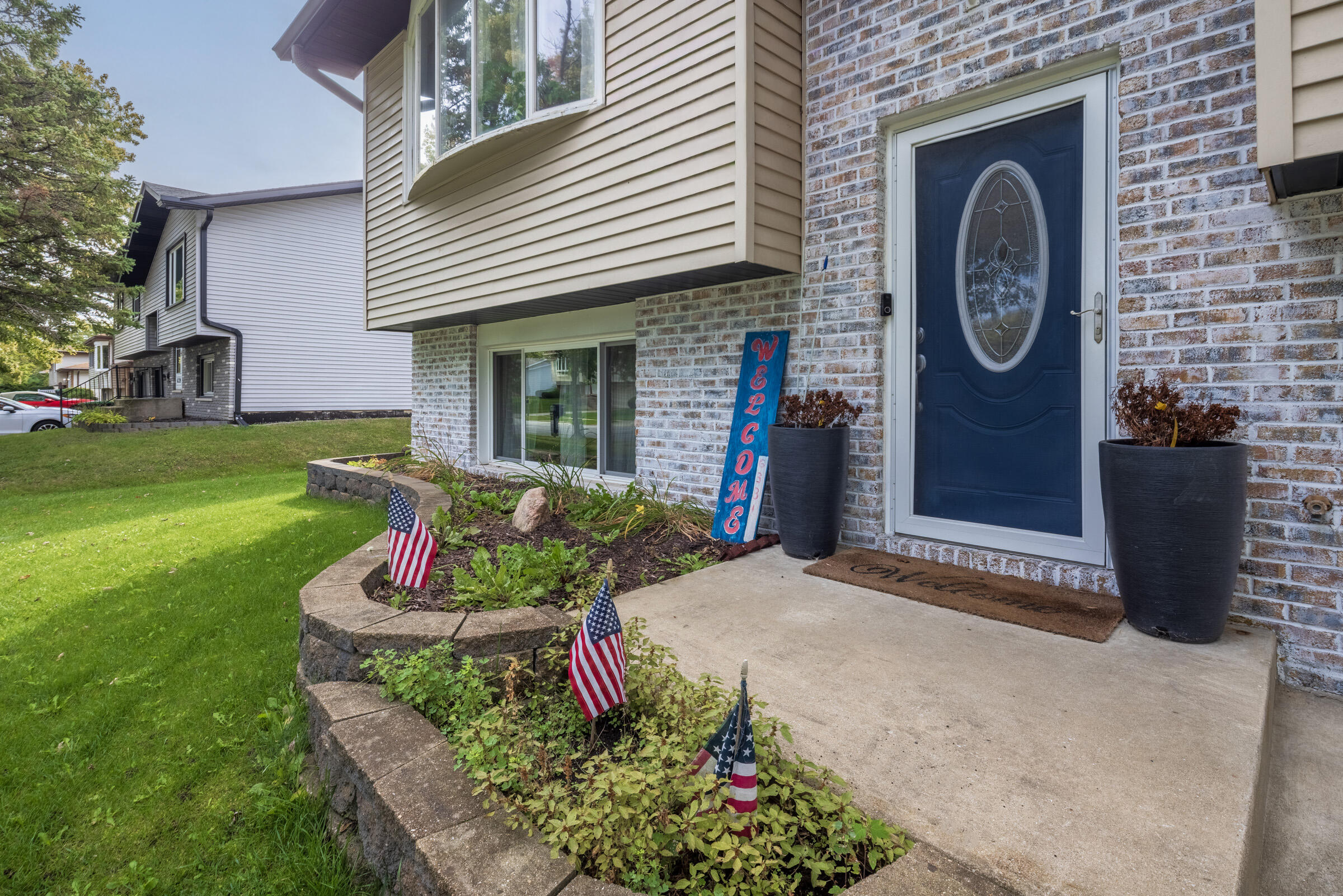 6331 Broughton Avenue Portage, IN 46368 - Photo 6 of 51 a front view of a house with a garden