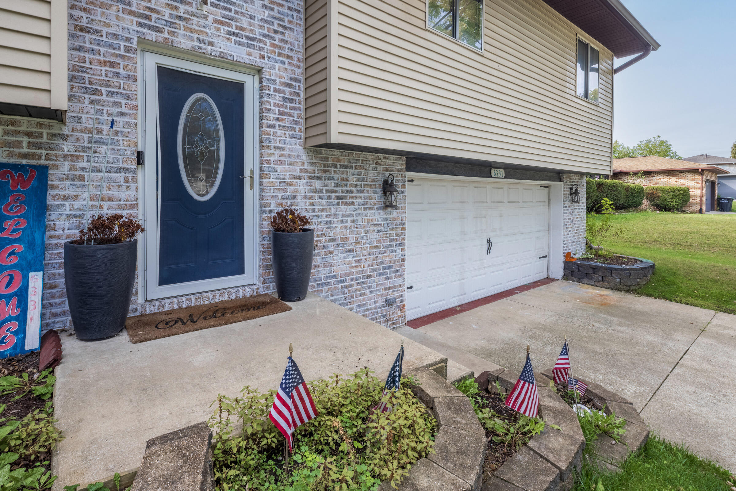 6331 Broughton Avenue Portage, IN 46368 - Photo 7 of 51 a front view of a house with a garage