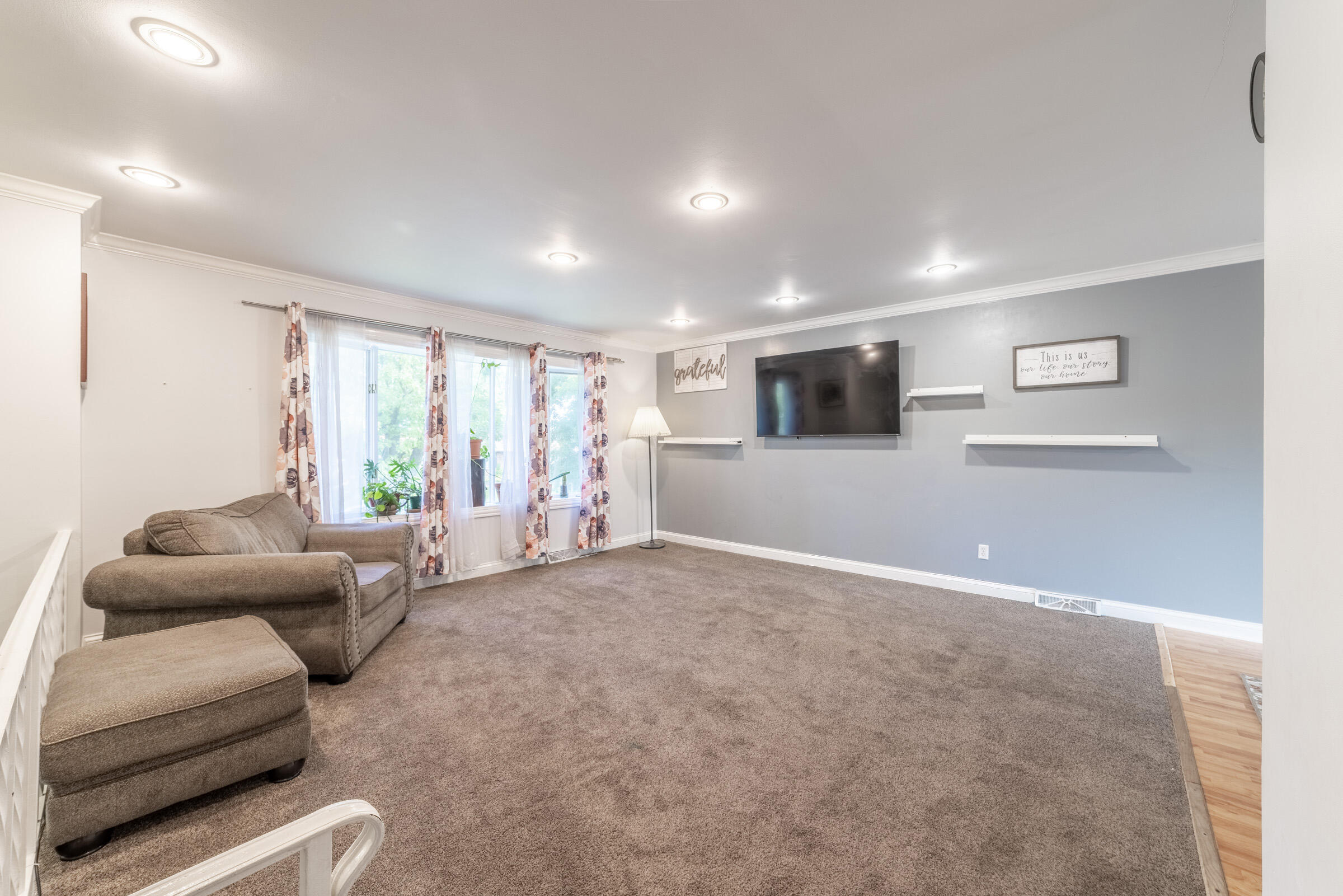 6331 Broughton Avenue Portage, IN 46368 - Photo 10 of 51 a living room with furniture and a flat screen tv
