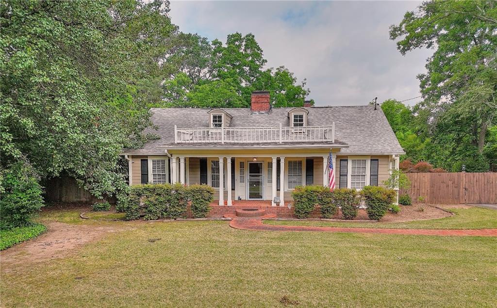 317 North Cherokee Road Social Circle, GA 30025 - Photo 2 of 32 a front view of house with yard and green space
