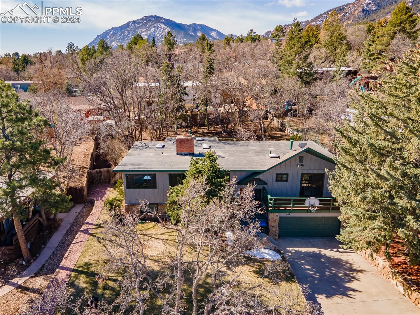 2601 Rigel Drive Colorado Springs, CO 80906 - Photo 1 of 50 Drone / aerial view featuring a mountain view