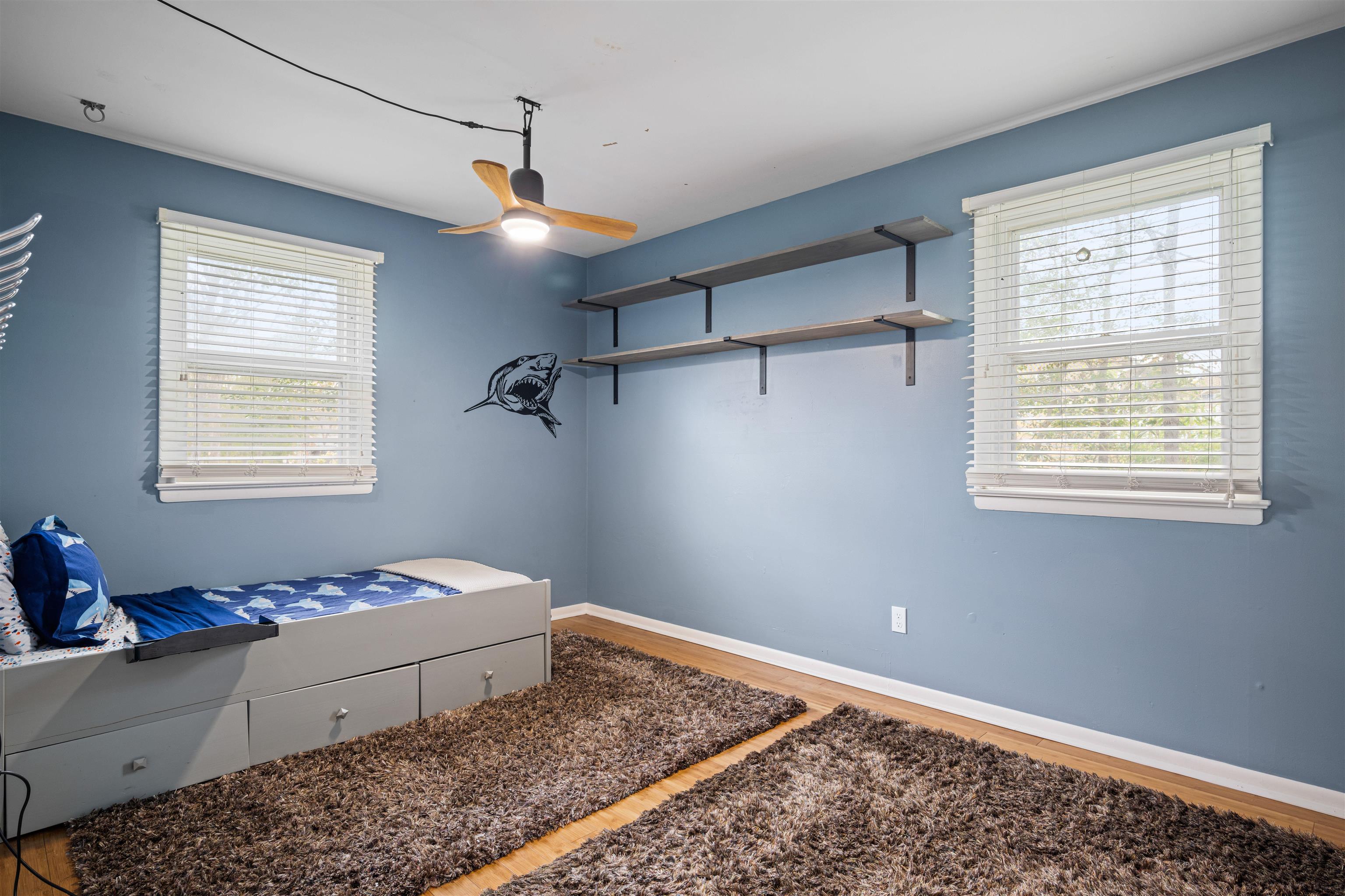 331 Holly Lane Erma, NJ 08204 - Photo 15 of 42 a bedroom with a bed and wooden floor