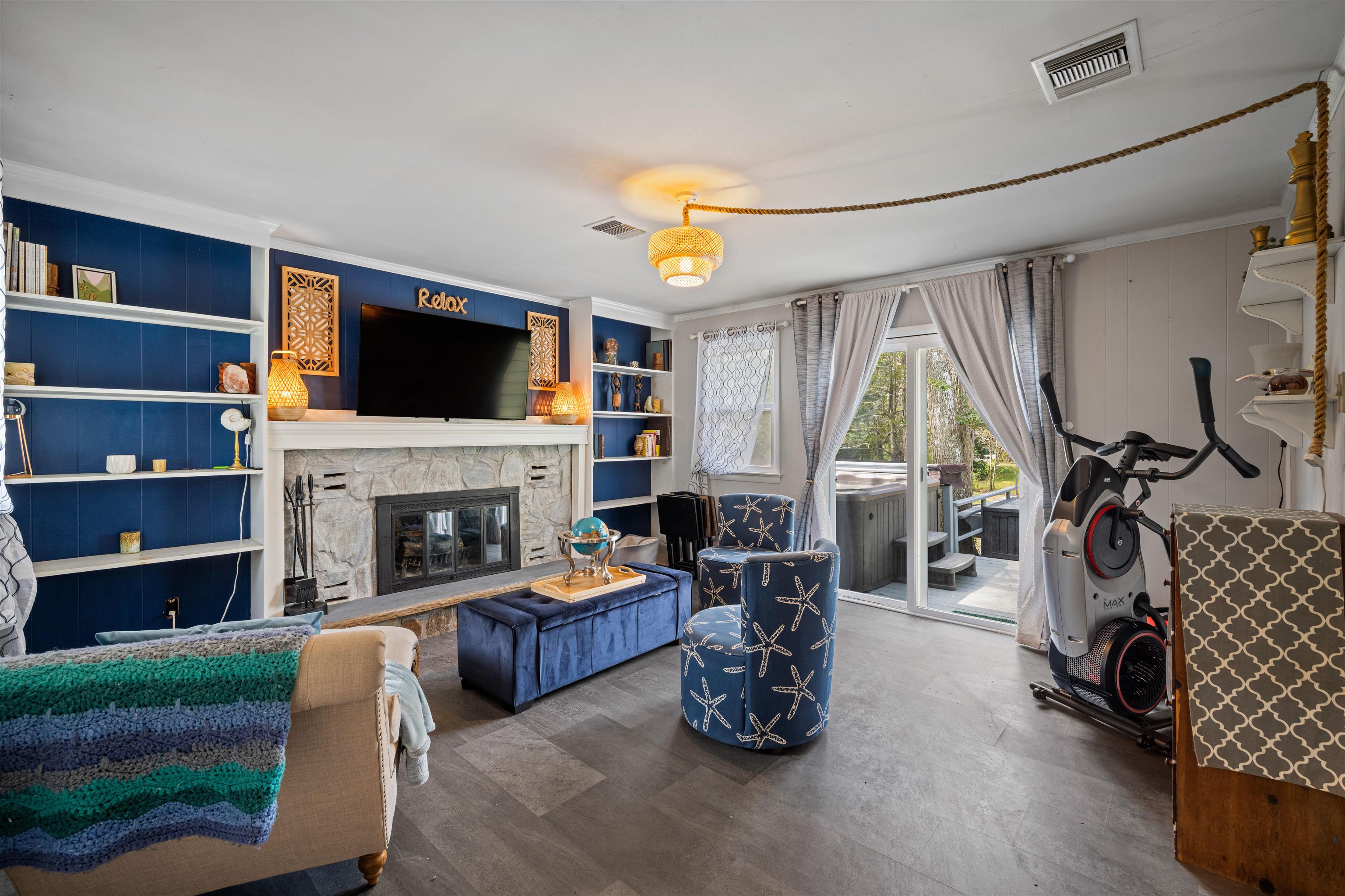 331 Holly Lane Erma, NJ 08204 - Photo 31 of 42 a living room with furniture a flat screen tv and a fireplace