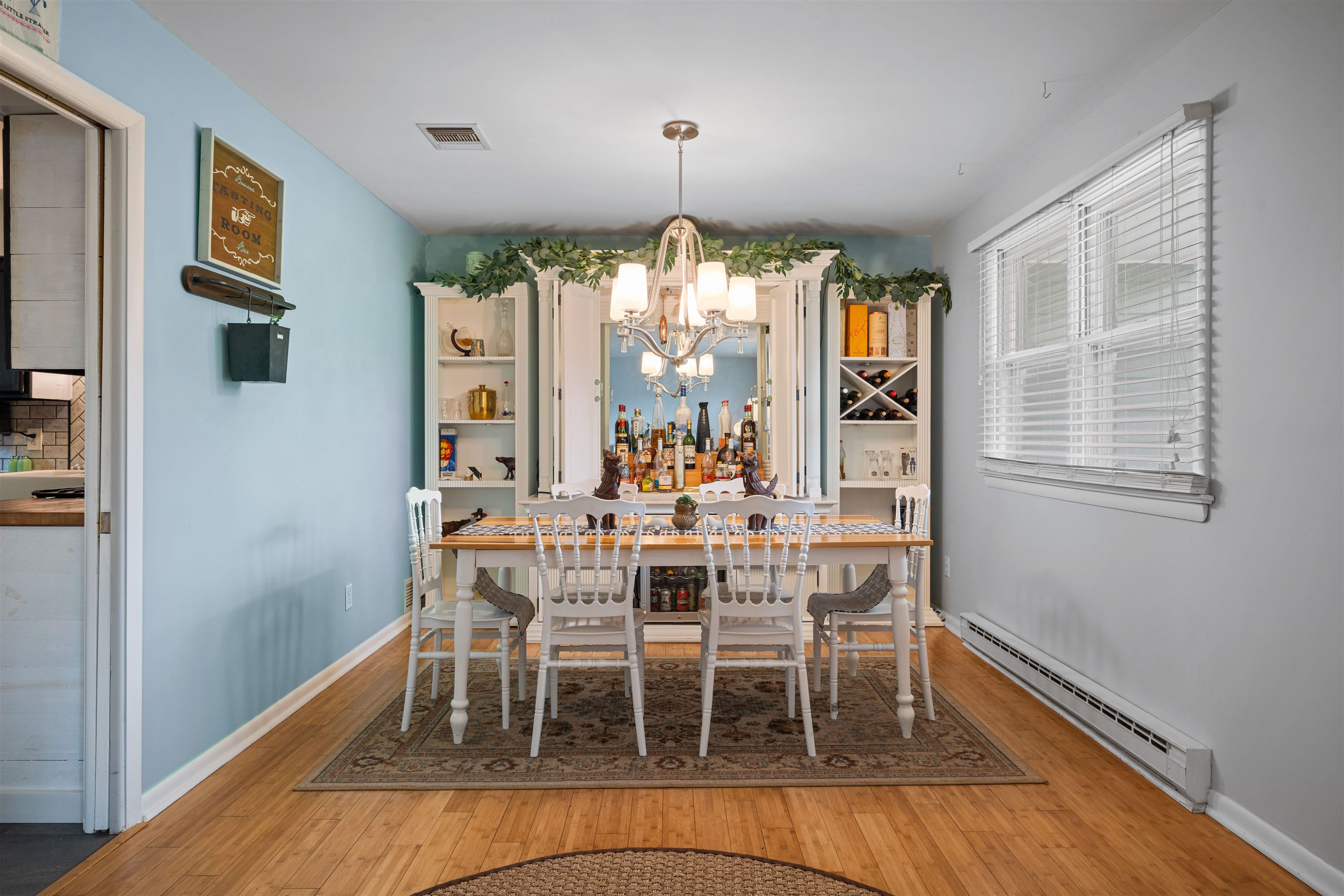 331 Holly Lane Erma, NJ 08204 - Photo 9 of 42 a view of a dining room with furniture window and wooden floor